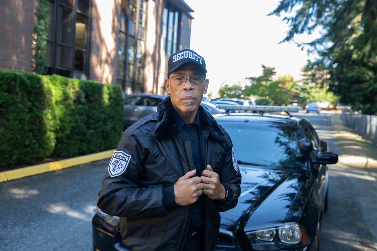 Carpe Diem Protection security officer standing near a patrol vehicle during security operations